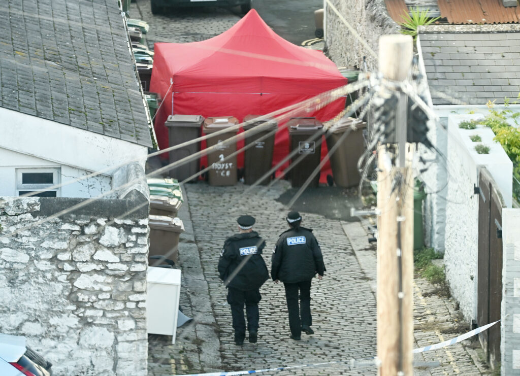 Man in his 30s arrested on suspicion of murder after man found partly ...